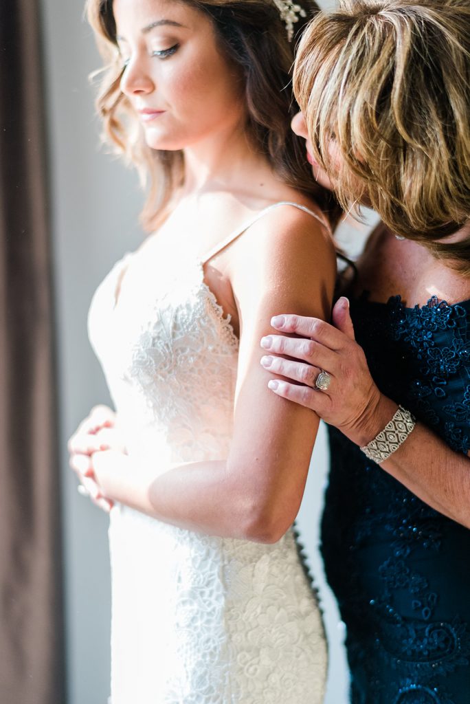 mother shares a moment with her daughter for falkirk wedding