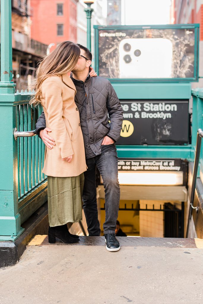 kiss outside subway of upper west side engagement session