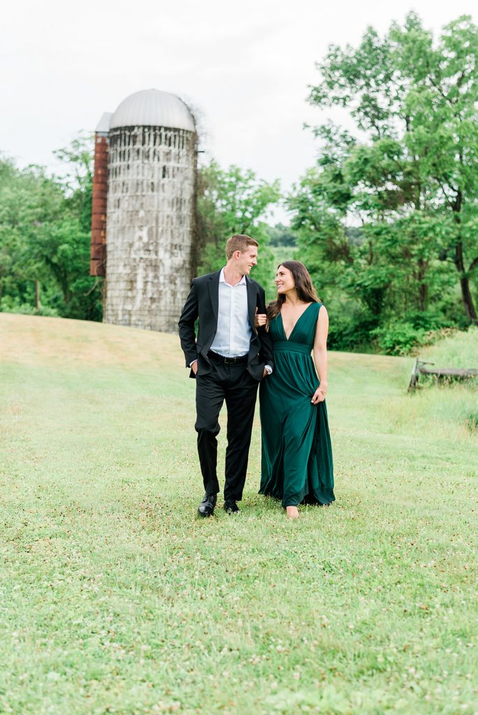 couple walking at farm during engagement pictures