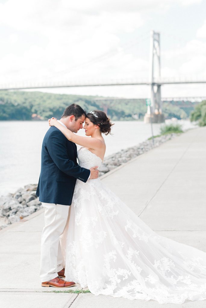 couple has sweet moment during wedding day portraits