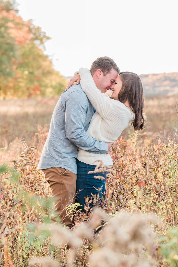 couple enjoys a sweet moment during their engagement session in new paltz