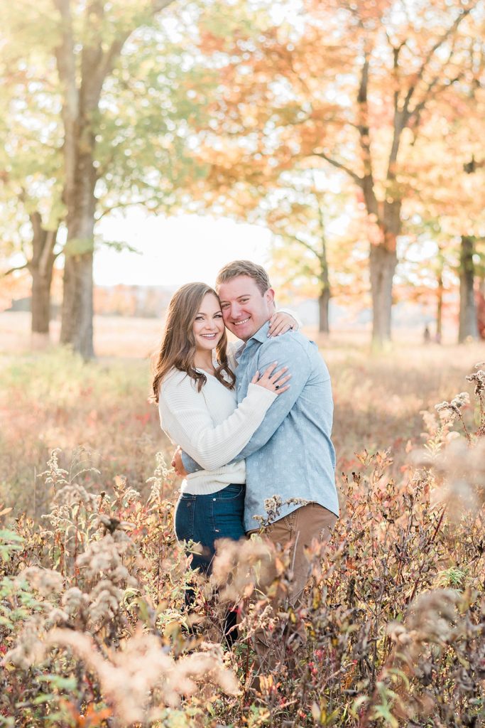 couple enjoys a sweet moment during their fall engagement session in the hudson valley
