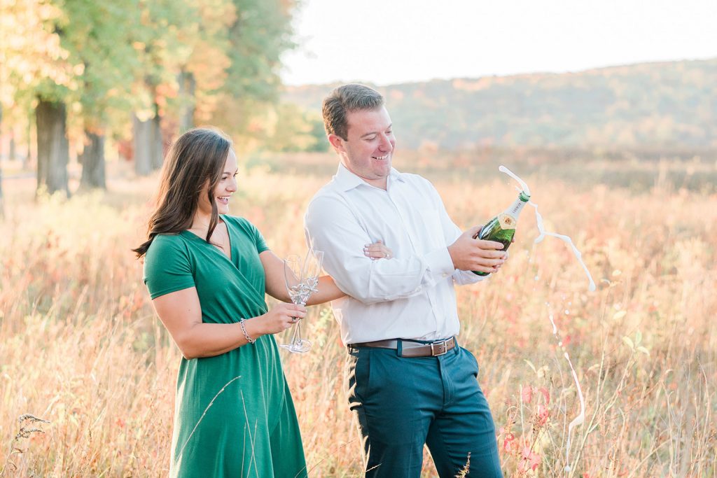 crazy champagne toast during fall engagement in new york