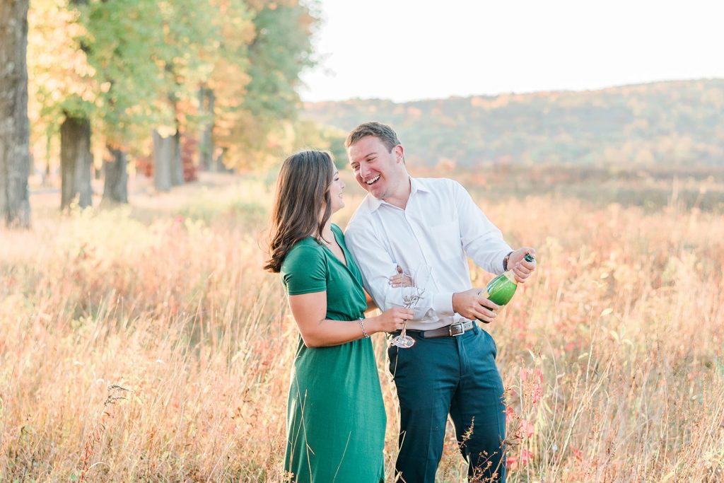 couple has a fun candid in fall engagement session in new paltz