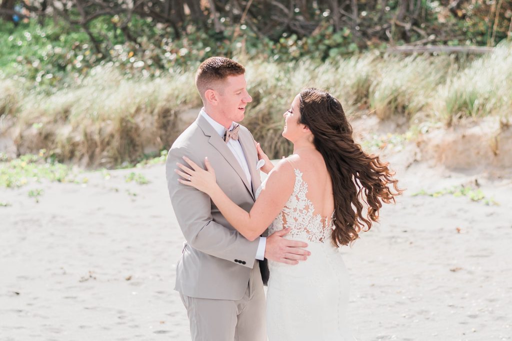 bride and groom first look on beach wedding