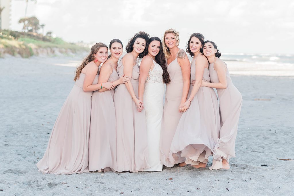 bride and bridesmaids have fun during portraits