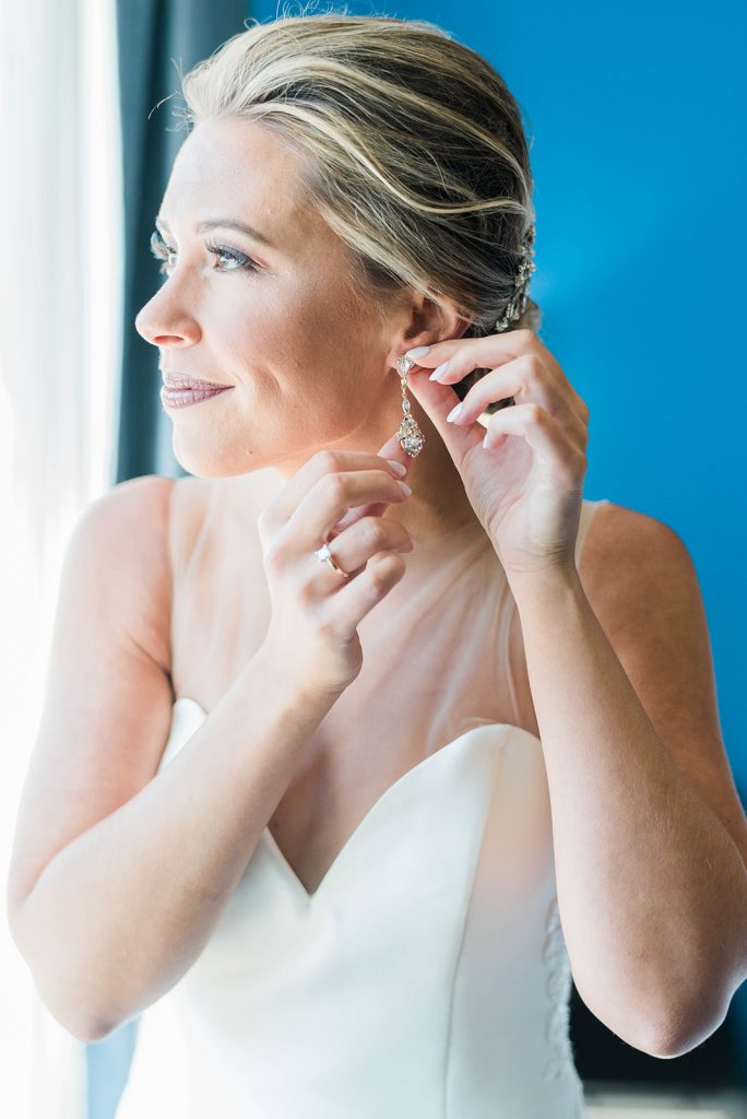 bride finishes getting ready for her wedding