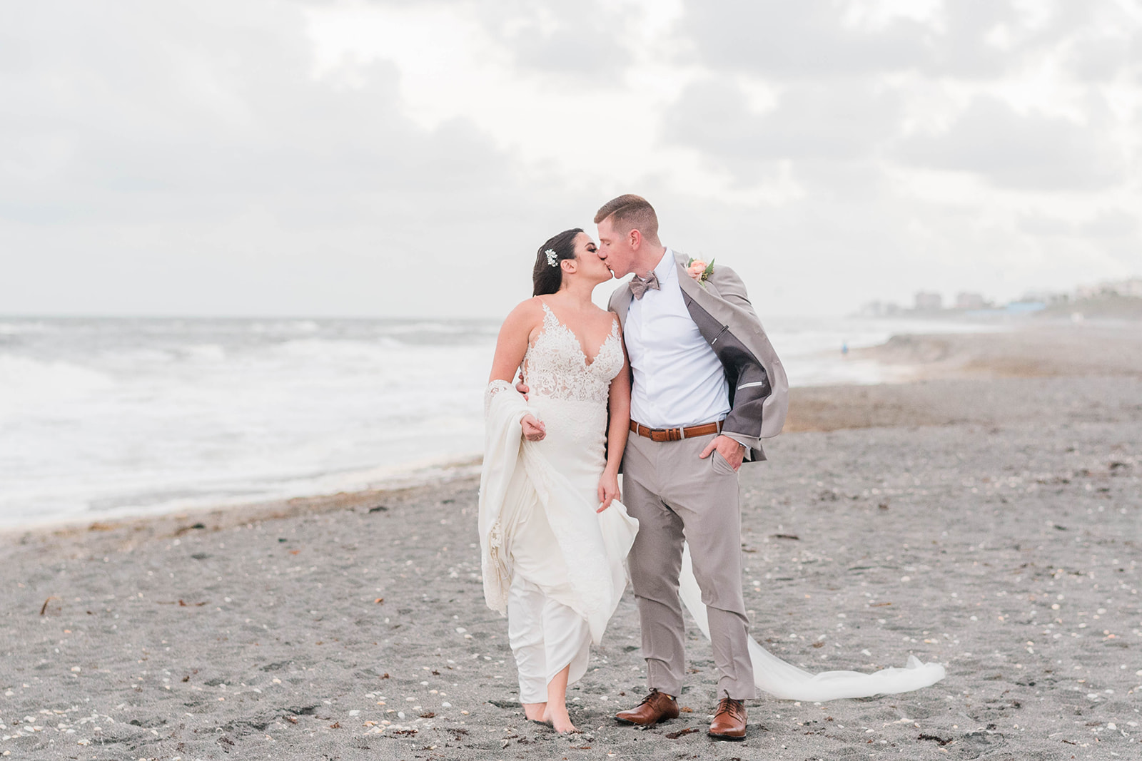 romantic kiss at jupiter beach wedding, florida