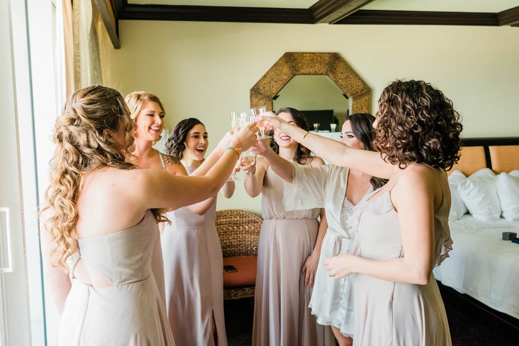 bride and her bridesmaids, having a toast before wedding, new york