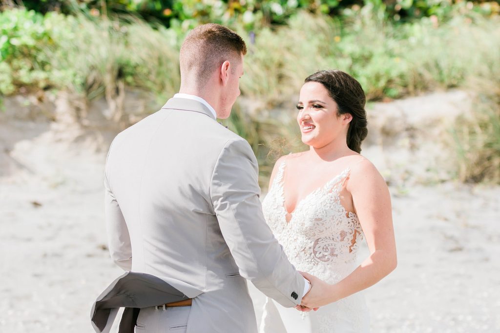 bride and groom enjoy their first look on wedding day