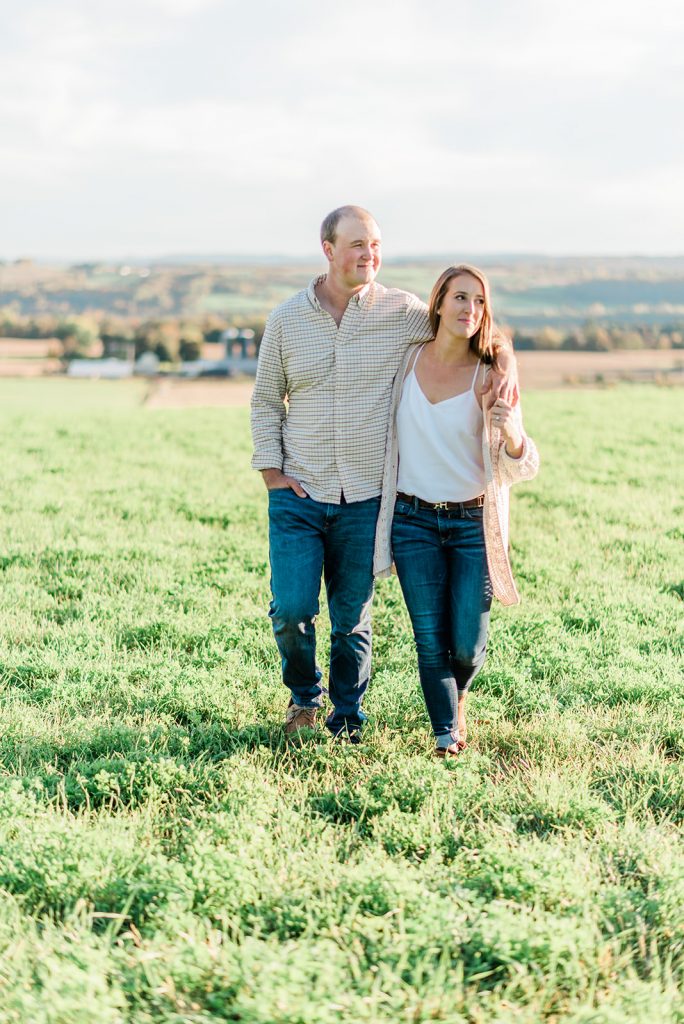 couple strolling on their farm for engagement session