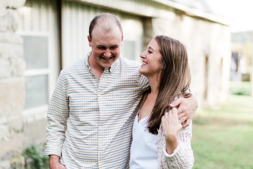 couple have a laugh during their adirondack engagement session