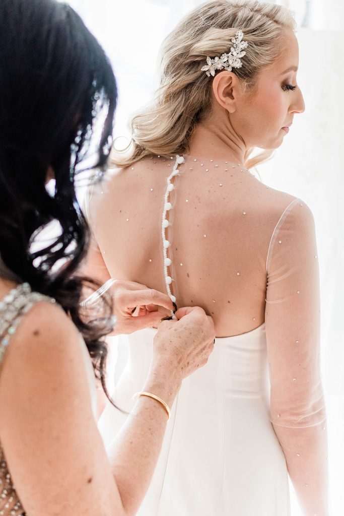 mother helps bride get ready for new jersey wedding