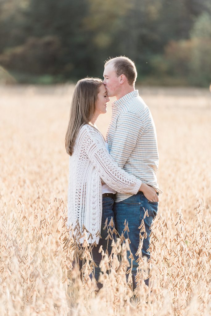 sweet moment in open field during engagement session