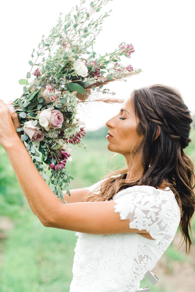 hudson valley bride with her wedding flowers