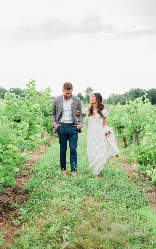 couple strolls during hudson valley winery wedding