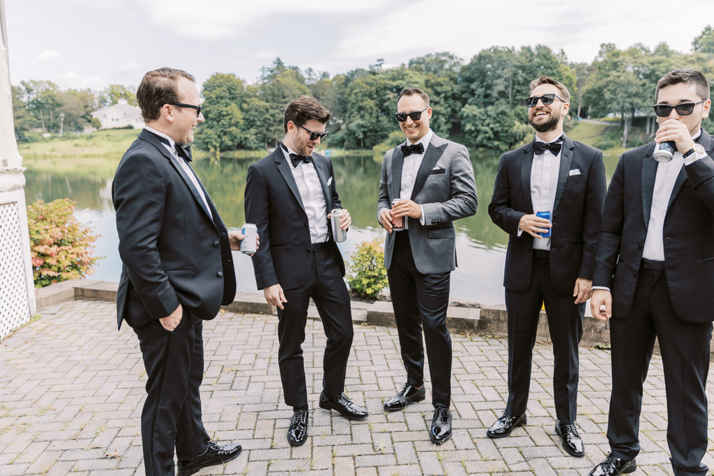 Groom toast with groomsmen for Hudson Valley wedding