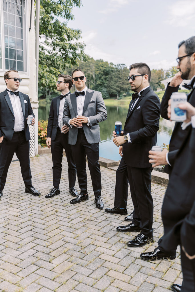 Groom hanging with groomsmen for Culinary Institute of America wedding
