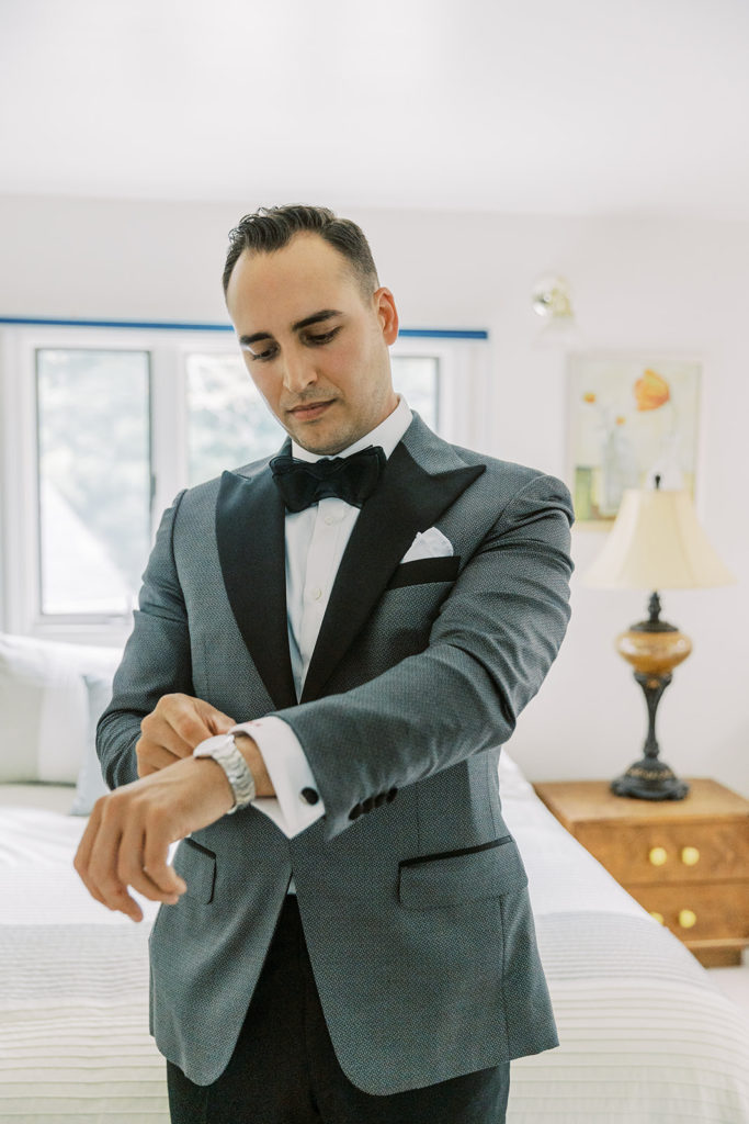 groom gets ready for CIA wedding