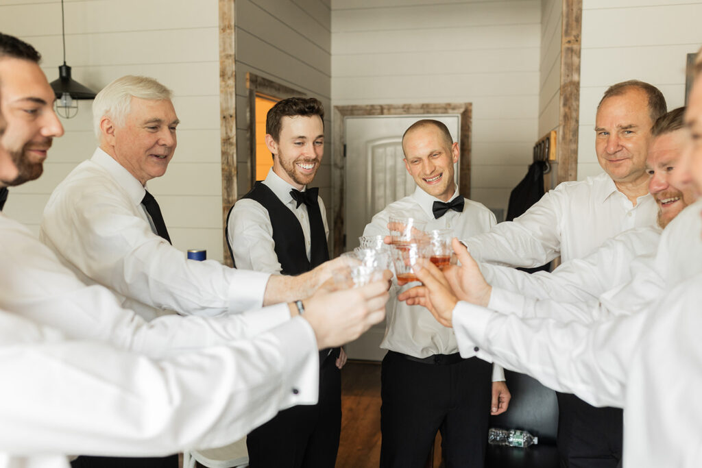 toast between groom and groomsmen during upstate new york wedding
